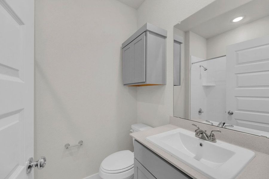 Bathroom in the Pecos home plan by Trophy Signature Homes – REPRESENTATIVE PHOTO