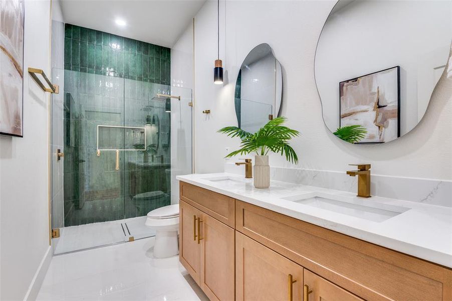 Full bath with a stall shower, double vanity, and light tile patterned floors Full bath with a stall shower, double vanity, and light tile patterned floors