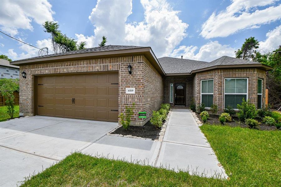 Front exterior of a new home in , Houston, TX, highlighting curb appeal (Image 1).