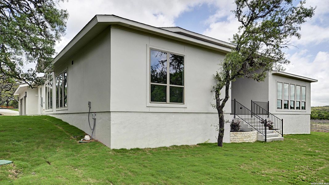 Exterior details and patio area of a home in George's Ranch, Boerne (Image 26).