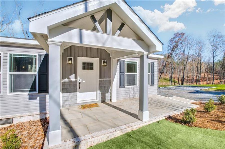 Front exterior of a new home in , Ball Ground, GA, highlighting curb appeal (Image 15).