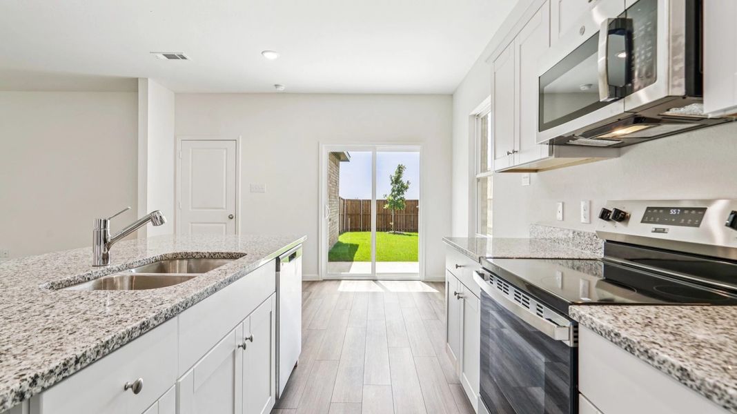 Representative furnished interior of a home built from the Jupiter by Starlight Homes in Brookshire at Legacy Hills, Celina (Image 8).