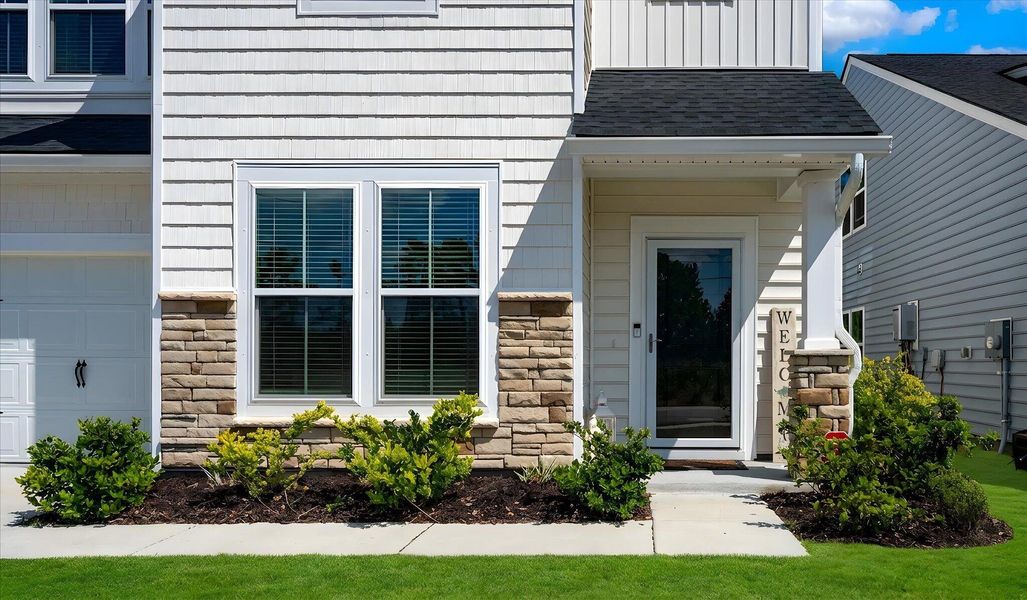 Exterior details and patio area of a home in , Johns Island (Image 29).