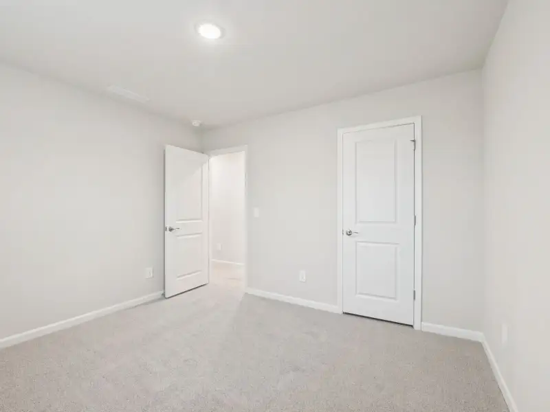 Spacious, unfurnished interior of a new home in Country Lane - Signature Series, Clayton (Image 21).