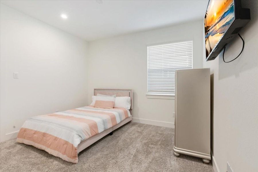 Furnished interior view inside a new home in Meridiana, Iowa Colony (Image 19).
