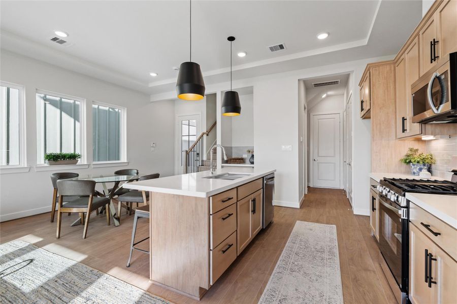 Smart layout with ample prep space and clear sightlines across the island into the dining area, keeping the cook connected to the room. Smart layout with ample prep space and clear sightlines across the island into the dining area, keeping the cook connected to the room.