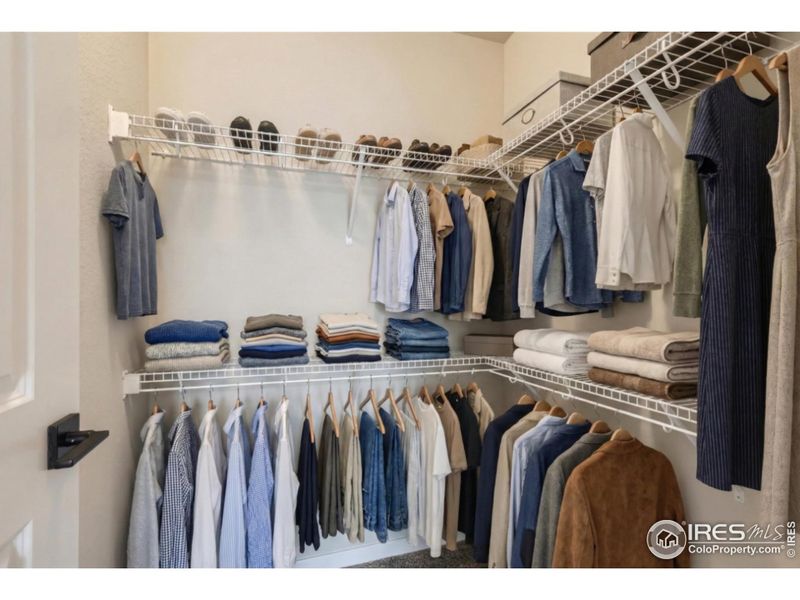 Primary walk-in closet Primary walk-in closet