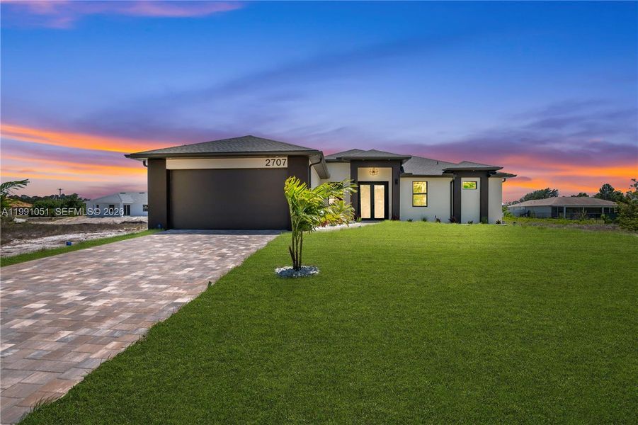 Front exterior of a new home in , Lehigh Acres, FL, highlighting curb appeal (Image 29).