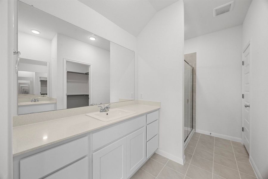 Primary Bath in the Cypress home plan by Trophy Signature Homes - REPRESENTATIVE PHOTO