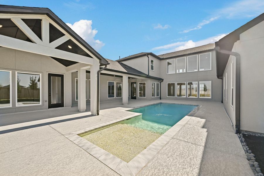 Exterior details and patio area of a home in Bridgeland, Cypress (Image 27).