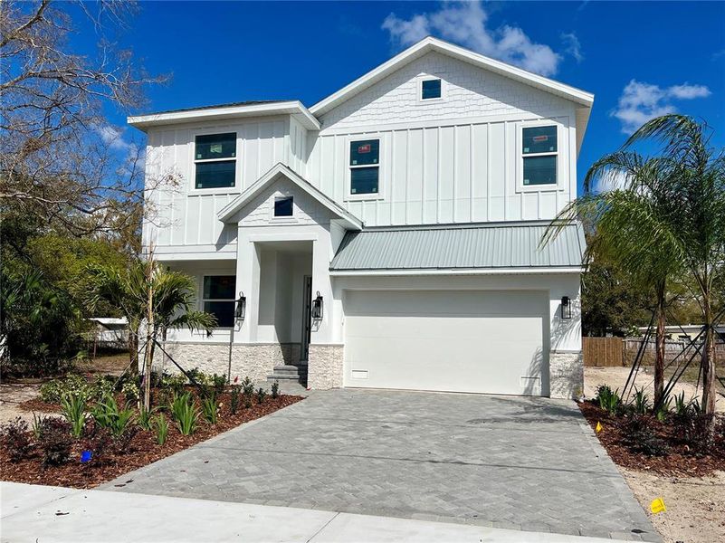 Front exterior of a new home in , Tampa, FL, highlighting curb appeal (Image 25).