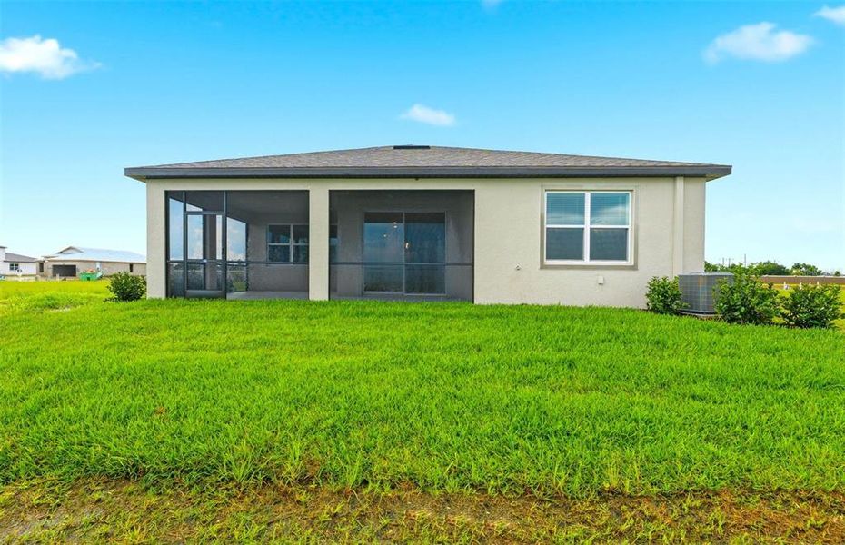 Exterior details and patio area of a home in Seaire, Parrish (Image 4).
