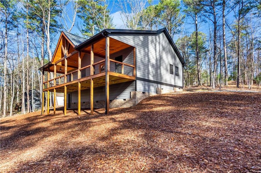 Exterior details and patio area of a home in , Ellijay (Image 19).
