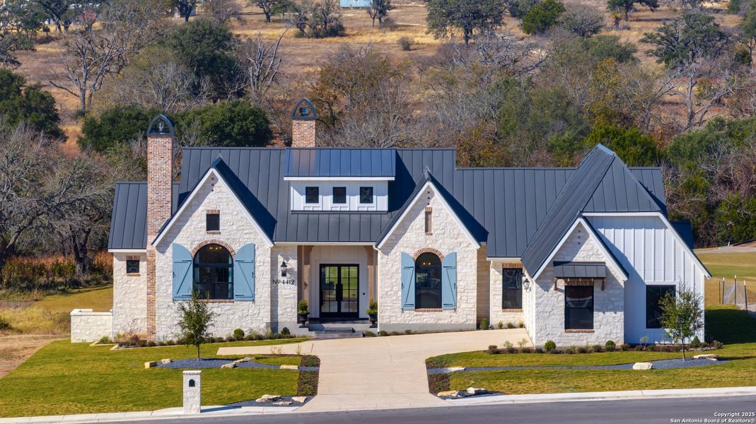 Front exterior of a new home in , Kerrville, TX, highlighting curb appeal (Image 2).