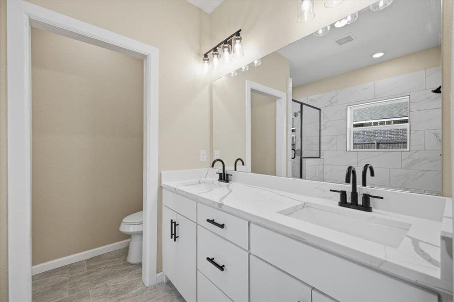 Bathroom featuring double sinks