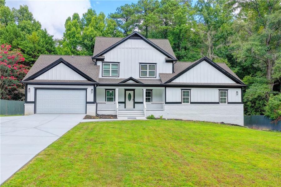 Front exterior of a new home in , Snellville, GA, highlighting curb appeal (Image 29). Front exterior of a new home in , Snellville, GA, highlighting curb appeal (Image 29).