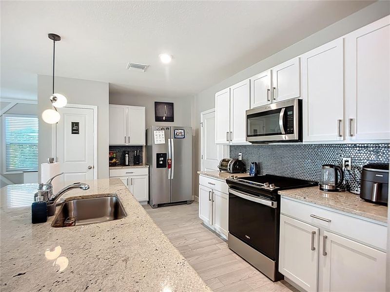 Furnished interior view inside a new home in Star Farms at Lakewood Ranch, Bradenton (Image 27).