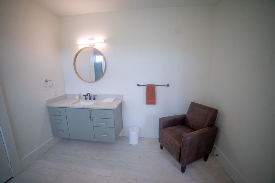 his alternative view reveals the true volume of the space, showcasing a bathroom designed for more than just the basics. The generous floor plan provides an open area perfect for a high-end vanity bench or a designer armchair, creating a seamless transition between your morning routine and a moment of relaxation