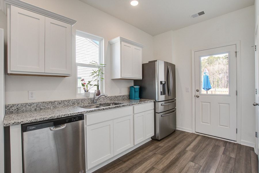 Furnished interior view inside a new home in Pender Woods at Cane Bay, Summerville (Image 11).