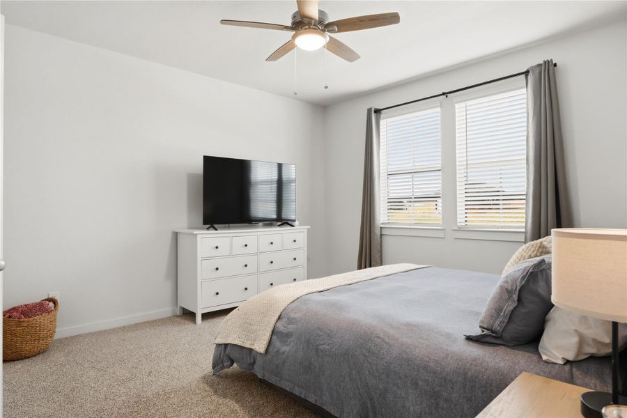 Bedroom with carpet and a ceiling fan