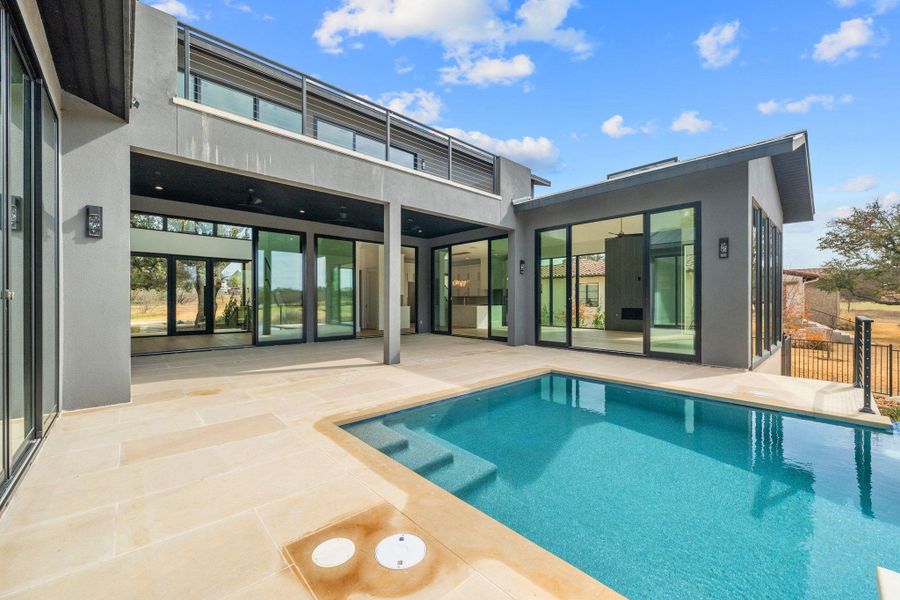 Back of property with a patio