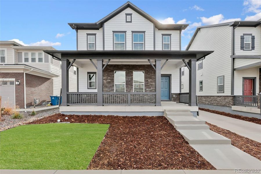 Front exterior of a new home in Painted Prairie Cottage, Aurora, CO, highlighting curb appeal (Image 22).