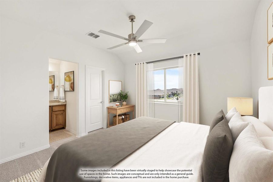 Bedroom with vaulted ceiling, ceiling fan, carpet flooring, and ensuite bathroom access Bedroom with vaulted ceiling, ceiling fan, carpet flooring, and ensuite bathroom access