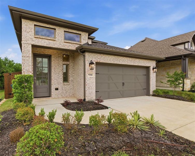 Front exterior of a new home in Prairie Oaks, Oak Point, TX, highlighting curb appeal (Image 22). Front exterior of a new home in Prairie Oaks, Oak Point, TX, highlighting curb appeal (Image 22).