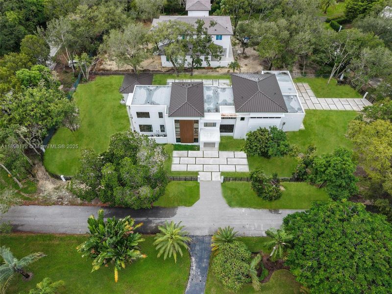 Front exterior of a new home in , Palmetto Bay, FL, highlighting curb appeal (Image 25). Front exterior of a new home in , Palmetto Bay, FL, highlighting curb appeal (Image 25).