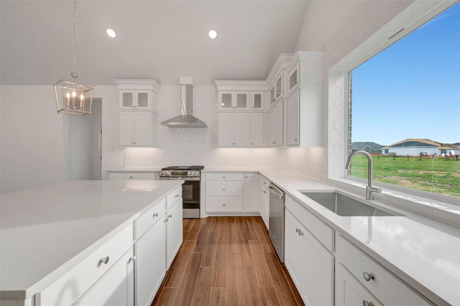 Gorgeous kitchen with stacked cabinets and quartz counters Gorgeous kitchen with stacked cabinets and quartz counters