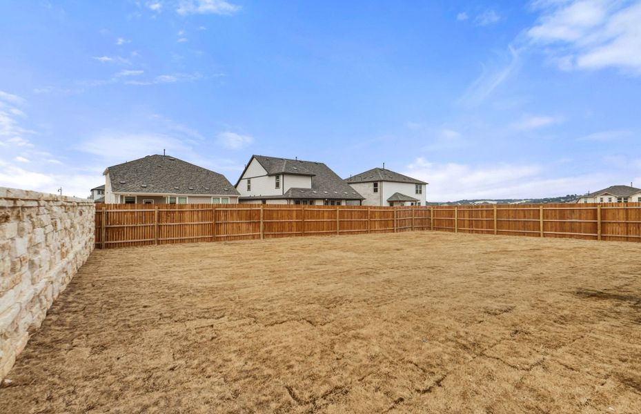 Exterior details and patio area of a home in Saddleback at Santa Rita Ranch, Liberty Hill (Image 25). Exterior details and patio area of a home in Saddleback at Santa Rita Ranch, Liberty Hill (Image 25).
