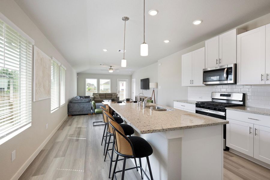 The open concept living area features a beautiful kitchen anchored by the large island! The open concept living area features a beautiful kitchen anchored by the large island!