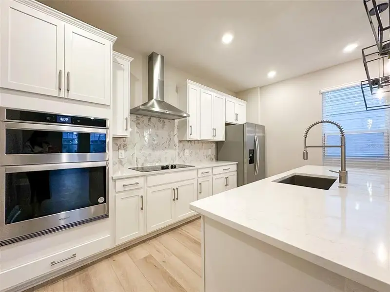 Furnished interior view inside a new home in Silverleaf Reserve Bungalows, Winter Garden (Image 7).