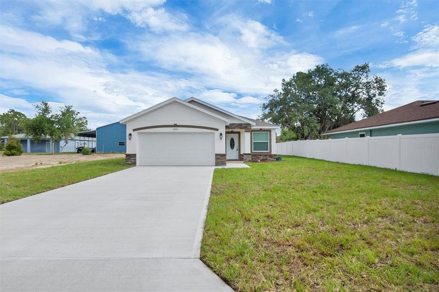 Front exterior of a new home in , Lake Wales, FL, highlighting curb appeal (Image 2). Front exterior of a new home in , Lake Wales, FL, highlighting curb appeal (Image 2).
