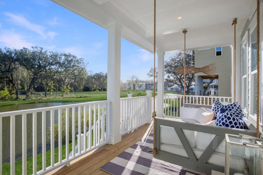 Exterior details and patio area of a home in Heron's Walk at Summers Corner: Row - Elevated Collection, Summerville (Image 2).