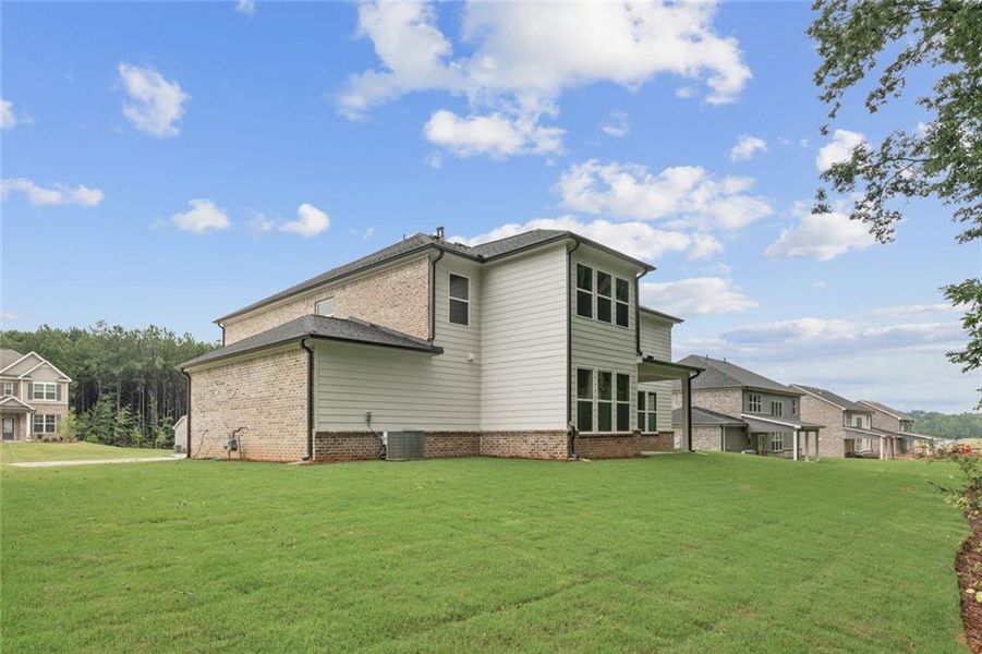 Exterior details and patio area of a home in Windsong Estates, McDonough (Image 22).