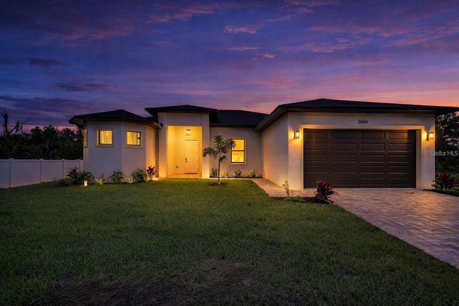 Front exterior of a new home in , North Port, FL, highlighting curb appeal (Image 2). Front exterior of a new home in , North Port, FL, highlighting curb appeal (Image 2).