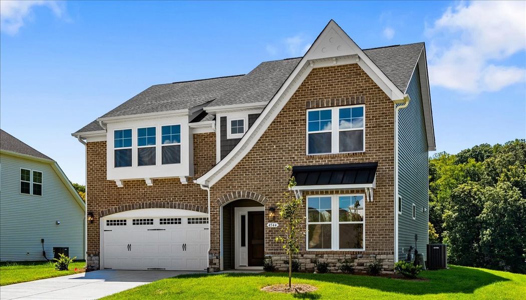Front exterior of a new home in Hanes Lake, Winston-Salem, NC, highlighting curb appeal (Image 23).