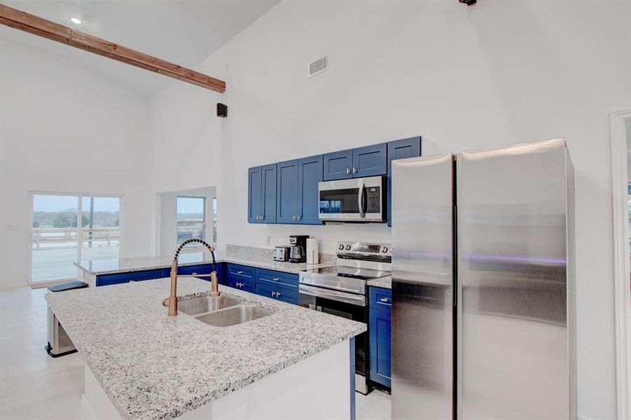 Kitchen with granite counter tops, all stainless appliances