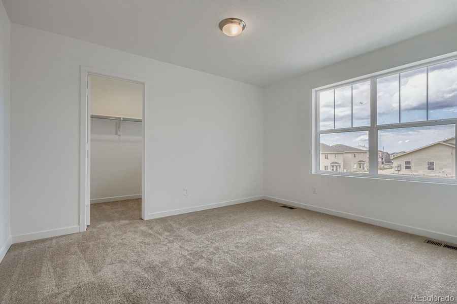 Spacious, unfurnished interior of a new home in Sky Ranch: Pioneer Collection, Watkins (Image 10).