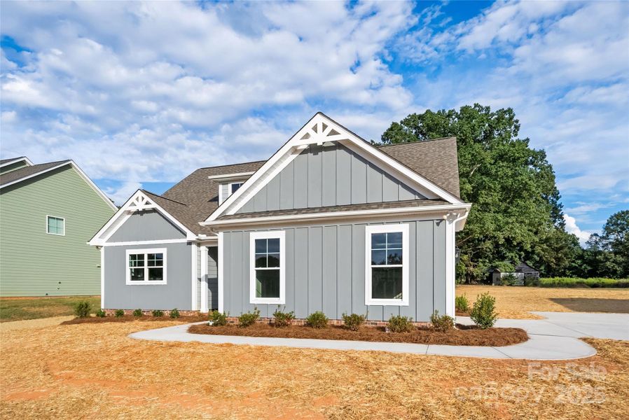 Front exterior of a new home in , Monroe, NC, highlighting curb appeal (Image 19).