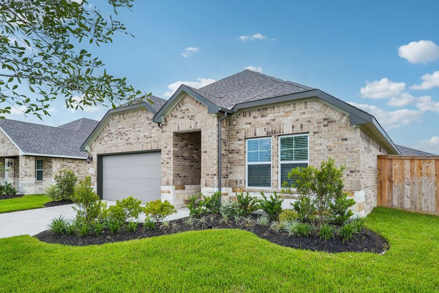 Front exterior of a new home in Massey Oaks - Premier Series, Pearland, TX, highlighting curb appeal (Image 2). Front exterior of a new home in Massey Oaks - Premier Series, Pearland, TX, highlighting curb appeal (Image 2).
