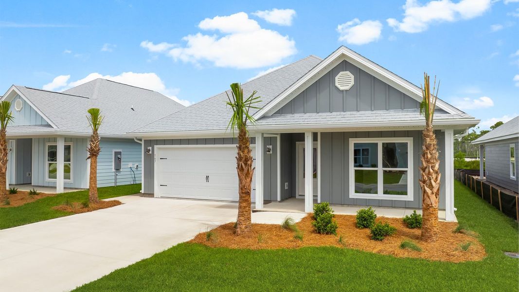 Front exterior of a new home in Windmark Beach, Port Saint Joe, FL, highlighting curb appeal (Image 2). Front exterior of a new home in Windmark Beach, Port Saint Joe, FL, highlighting curb appeal (Image 2).