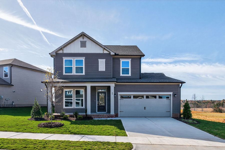 Front exterior of a new home in Serenity - The Village Collection, Fuquay Varina, NC, highlighting curb appeal (Image 2).