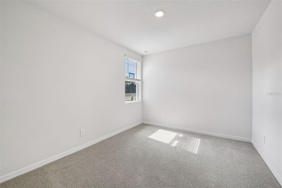 Spacious, unfurnished interior of a new home in Ridgehaven - Villas, Ormond Beach (Image 23).