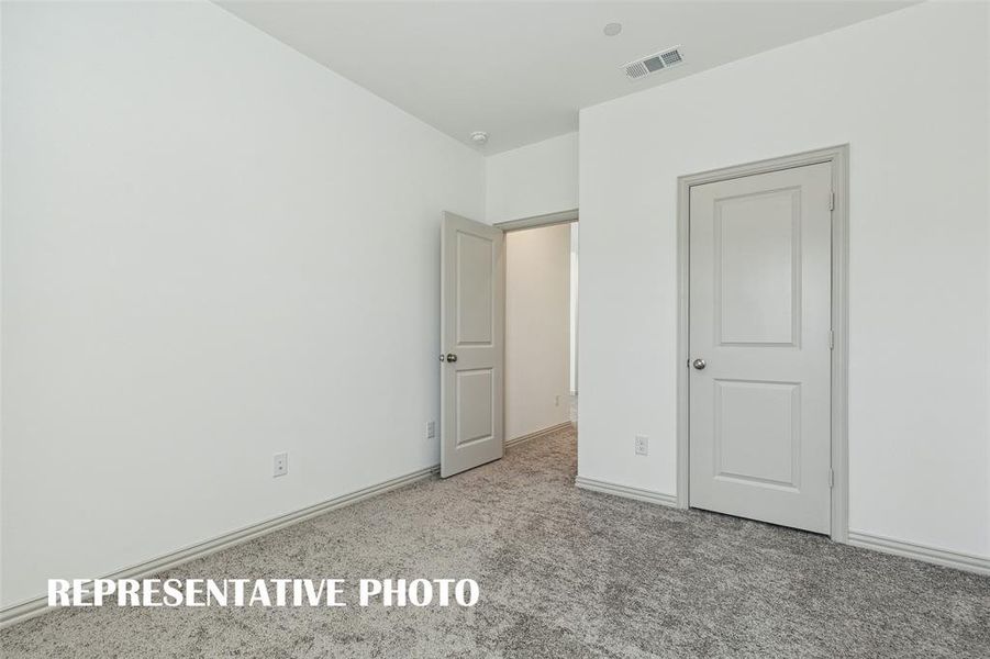 You'll find a nicely sized secondary bedroom with walk-in closet in this great home!  REPRESENTATIVE PHOTO