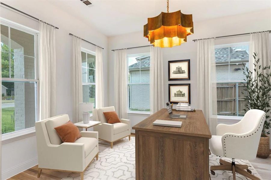Office featuring light wood-style floors and healthy amount of natural light