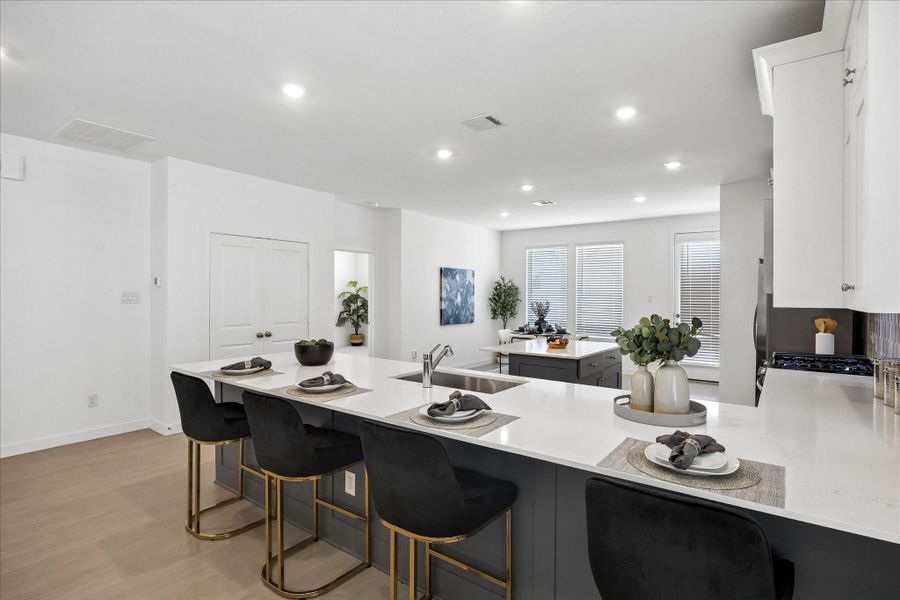Pull up a stool and stay awhile. This long kitchen bar is the perfect perch for morning coffee, late night snacks and everything in between.