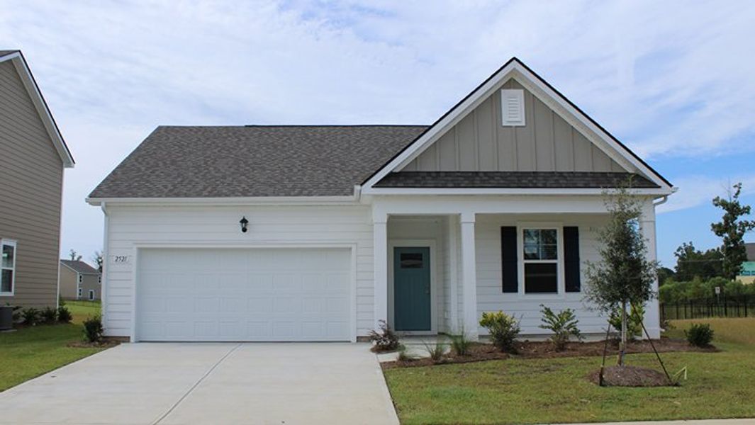 Front exterior of a new home in Auberon Woods, Conway, SC, highlighting curb appeal (Image 1).