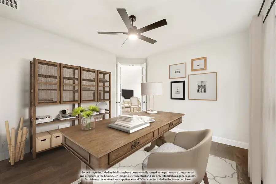 Home office with wood desk, ceiling fan, open shelving unit, and hardwood floors Home office with wood desk, ceiling fan, open shelving unit, and hardwood floors
